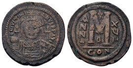 Justinian I (1 August 527 – 14 November 565) AE Follis or 40 nummi (34mm, 21g.), year XVIII (543-544). D N IVSTINI – ANVS PP AVG - Helmeted, pearl-dia...