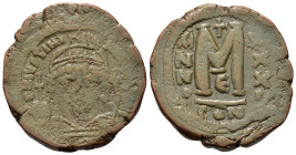 Justinian I (527-565). Æ 40 Nummi (31mm, 18g). Constantinople, year 32 (AD 558/559). Helmeted and cuirassed bust facing, holding globus cruciger and s...