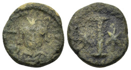 Justinian I (527-565). Æ 10 Nummi (17mm, 4.9g.). Rome or Ravenna, 547-549. Helmeted and cuirassed facing bust, holding globus cruciger and shield. R/ ...