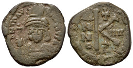 Maurice Tiberius (582-602). Æ 20 Nummi (23,5mm, 6.2g). Constantinople, year 9 (590/91). Diademed, helmeted and cuirassed facing bust, holding globus c...