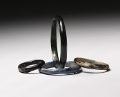 Group of 4 of Ancient Roman Glass Bracelets 1st-3rd Century CE. Variety of Sizes and Colors . Estimate: 400 Euro- 800 Euro