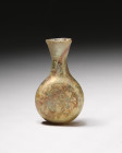 "An incredible lathe-cut two-sided glass flask from the Byzantine Period, circa 9th Century. This mold-blown flask features a lathe-cut design on both...