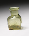 **Item Description**

A beautifully crafted green blown molded square glass bottle from the 3rd-4th Century CE, measuring 7.2 cm tall. Each of its fou...