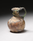**Item Description**

A finely crafted single-handled jug with neck collar from the 4th-5th Century C.E., made of semi-translucent green glass with a ...