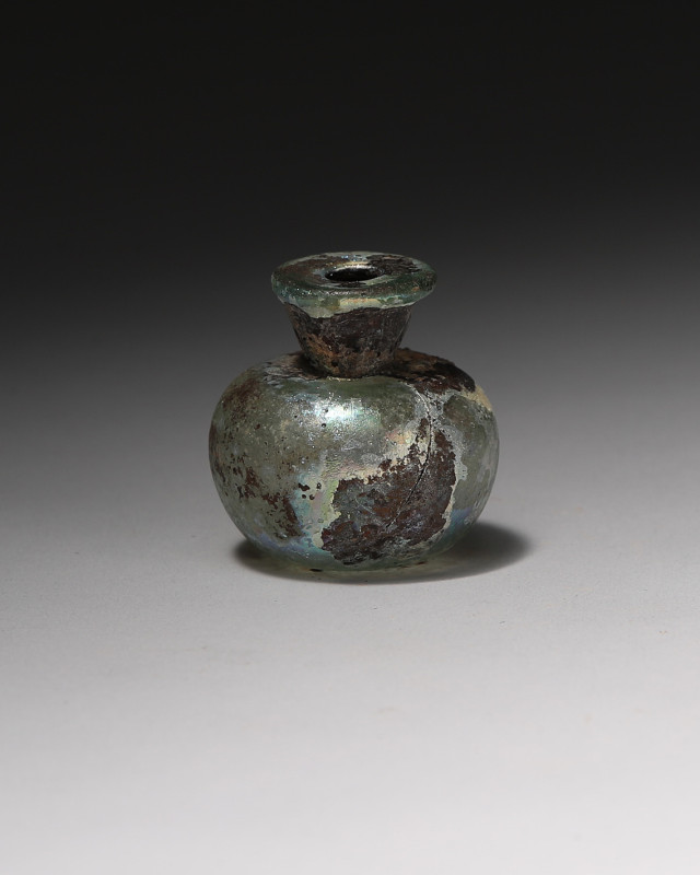 **Item Description:**

**Title:** Glass Bottle

**Era:** Roman, 2nd Century CE

...