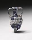 Item Description: Ancient Greek Core-Formed Glass Amphoriskos
 Era: Ca. 6th to 4th century BCE

A stunning example of a core-formed glass amphoriskos ...