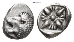 Ionia. Miletos circa 520-470 BC. Diobol AR (9mm, 1.26 g). Forepart of lion to right, head turned back to left / Star-shaped floral ornament within inc...