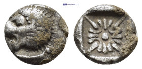 IONIA, Miletos. (Late 6th-early 5th centuries BC).AR Obol (9mm, 1.0 g). Obv: Forepart of lion right, head left. Rev: Stellate floral design; all withi...