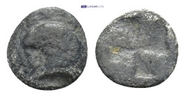 IONIA, Uncertain. Circa 480-450 BC. AR Tetartemorion (0.36 Gr. 8mm.)
 Helmeted male head right (?) 
Rev. Quadripartite incuse square.