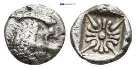 Ionia. Miletos circa 520-470 BC. Diobol AR (10mm, 1.0 g). Forepart of lion to right, head turned back to left / Star-shaped floral ornament within inc...