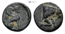 CARIA. Kaunos. Ae (Circa 350-300 BC). AE (1.06 Gr. 10mm.)
 Sphinx seated right. K - A.
Rev. Forepart of bull right.