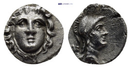 Pisidia. Selge circa 350-300 BC. Obol AR (10mm, 0.63 g) Gorgoneion / Head of Athena to right, wearing crested Attic helmet; behind, astragalos.