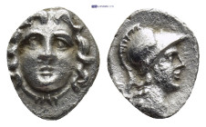 Pisidia. Selge circa 350-300 BC. Obol AR (10mm, 0.64 g) Gorgoneion / Head of Athena to right, wearing crested Attic helmet; behind, astragalos.