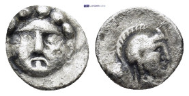 Pisidia. Selge circa 350-300 BC. Obol AR (9mm, 0.69 g) Gorgoneion / Head of Athena to right, wearing crested Attic helmet; behind, astragalos.