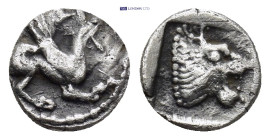 TROAS. Assos. (Circa 500-450 BC). AR Obol. (9mm, 0.67 g) Obv: Griffin seated to right, raising forepaw Rev: Head of roaring lion to right within shall...