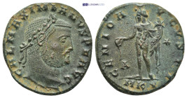 Galerius Maximianus AD 305-311. Cyzicus Follis AE. (6.91 Gr. 24mm.)
laureate head right 
Rev. Genius standing left, holding patera and cornucopia.