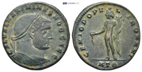 Maximinus II, as Caesar, AE Nummus. Heraclea, AD 305-306. (8.29 Gr. 27mm.)
Laureate head right 
Rev. Genius standing left, modius on head, holding pat...