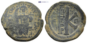 Justinian I (527-565). Æ 20 Nummi (26mm, 8.1 g). Theoupolis (Antioch). Justinian enthroned facing, holding cross on globe and long sceptre. R/ Large K...