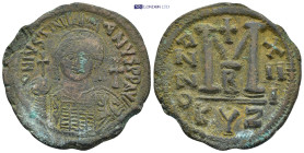 Justinian I. 527-565. AE Follis (20.82 Gr. 38mm.). Cyzicus mint, 2nd officina. 
 Helmeted and cuirassed bust facing, holding globus cruciger and shiel...