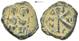 Justin II, with Sophia. 565-578. AE Half Follis. (6.9 Gr. 22mm.)
 Justin and Sophia, both nimbate, enthroned facing; Justin holding globus cruciger an...