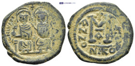 JUSTIN II and SOPHIA. Follis. Ae. (30mm, 13.7 g). 565-578 AD Nicomedia. Obv: Justin II and Sofia seated facing each other. Rev: Large M, above Latin c...