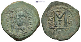 Maurice Tiberius (582-602). ’ 40 Nummi (11.64 Gr. 30mm.). Constantinople
 Helmeted and cuirassed bust facing, holding globus cruciger. 
Rev Large M, c...