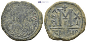 Maurice Tiberius AD 582-602. Theoupolis (Antioch) Follis Æ (29mm., 11.5 g). DN MaYP-AYT, emperor wearing consular robes, mappa and eagle-tipped scepte...
