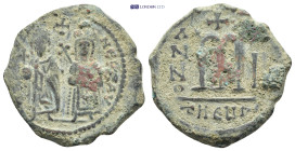 PHOCAS (602-610). Follis. Antioch. (9.84 Gr. 28mm.)
Phocas and Leontia standing facing with globus cruciger and cruciform sceptre; between their heads...