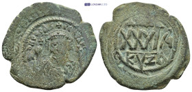 Phocas; 602-610 AD. Cyzicus, AE (11.46 Gr. 31mm.)
 Crowned bust facing, wearing consular robes, and holding mappa and cross; with small cross in field...