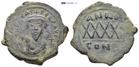 Phocas. 602-610. Æ Follis (31mm, 10.5 g). Constantinople mint. Crowned bust facing, wearing consular robes, holding mappa and cruciform scepter / Larg...