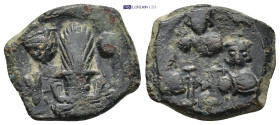 Constans II (641-668 AD). Constantinople AE Follis (5.61 Gr. 20mm.) Obv: Bust of Constans facing with long beard and plumed helmet, holding globus cru...