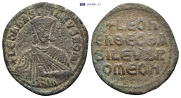Leo VI the Wise. AD 886-912. Constantinople Follis Æ (26mm, 5.6 g). + LEON bASILEVS ROM star, Leo, crowned and wearing loros, seated facing on lyre-ba...