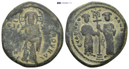 Constantine X Ducas and Eudocia AD 1059-1067. Constantinople Follis Æ (28mm. 9.52 g). Christ standing facing on footstool, holding Gospels / Constanti...