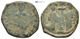 Constantine X Ducas, with Eudocia. 1059-1067. AE Follis (24mm, 8.94 g) Constantinople mint. Christ standing facing on footstool Rev: Constantine and E...