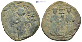 Constantine X Ducas, with Eudocia. 1059-1067. AE Follis (26mm, 7.76 g) Constantinople mint. Christ standing facing on footstool Rev: Constantine and E...