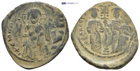 Constantine X Ducas, with Eudocia. 1059-1067. AE Follis (28mm, 7.31 g) Constantinople mint. Christ standing facing on footstool Rev: Constantine and E...