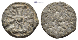 Lead Seal. (16mm, 4.19 g) Obv: Cross with floral ornaments. Rev: Blank.