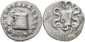 LYDIA,
Tralleis. Cistophoric standard.
Tetradrachm
(AR, 28 mm, 12.69 g)
c. 166-67 BC.

Cista mystica within ivy wreath with fruits. / ΤΡΑΛ Two s...