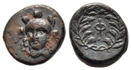 PHOKIS. Federal Coinage. AE (late 4th- early 3rd centuries BC).

Obv: Head of Athena in Attic helmet facing slightly left.
Rev: Φ within wreath. 

BCD...