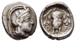 ATTICA. Athens. Triobol (circa 449-404 BC).

Obv: Helmeted head of Athena to right. 
Rev: Α-Θ-Ε Owl standing facing between two olive branches. 

HGC ...