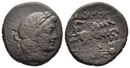 LYDIA. Tralles. AE (circa 300-200 BC).

Obv: Laureate head of Apollo right.
Rev: [TPAΛ] / ΛIANΩN // [magistrates name]
Nike driving quadriga right; to...