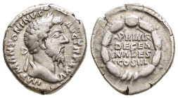 MARCUS AURELIUS (161-180). Denarius. Rome.

Obv: IMP M ANTONINVS AVG TR P XXV.
Laureate head right.
Rev: PRIMI / DECEN / NALES / COS / III.
Legend in ...