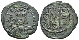 THEOPHILUS (829-842). Follis. Constantinople.

Obv: (star) ΘЄOFIL ЬASIL.
Crowned and draped bust facing, holding patriarchal cross and akakia.
Rev: La...