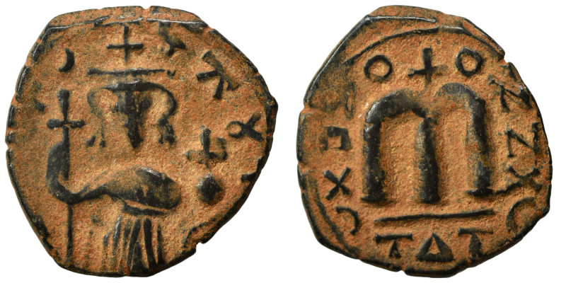 Arab-Byzantine, Umayyad Caliphate. Fals (bronze, 3.75 g, 21 mm). Standing imperi...