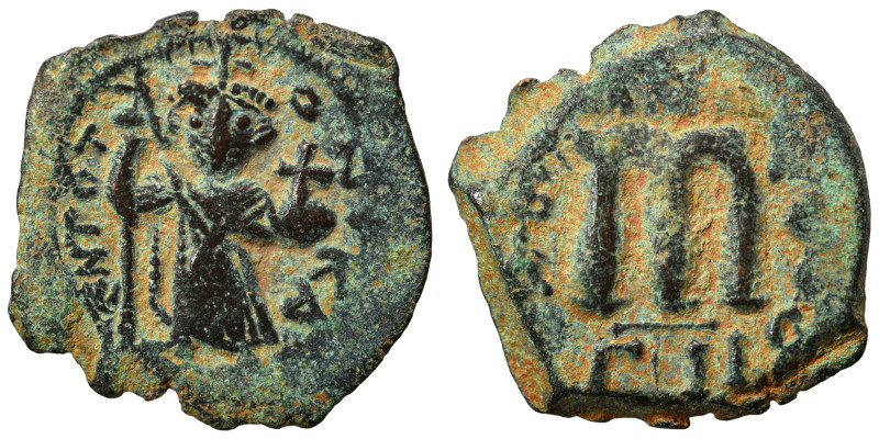 Arab-Byzantine, Umayyad Caliphate. Fals (bronze, 5.16 g, 25 mm). Standing imperi...