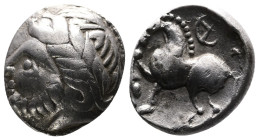 Middle Danube Tribes ''Kugelwange" type. AR Drachm (13,5mm, 2,50g.) Imitating the types of Philip II of Macedon. 3rd. Century BC. Celticized laureate ...