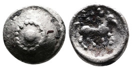 Central European Tribes, Boii. 1st. Century BC. AR Obol (8,5 mm, 0,64 g.) Pellet in two circular borders of dots. Rev. Horse galloping right; above, s...