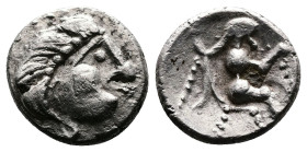 Eastern Celtic Tribes. Late 2nd. Century BC. AR Obol ( 9 mm, 0.58g,). Celticized male head to left. Rev. Celtizied Zeus seating on throne. Extremely F...