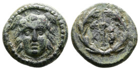 Lykaonia. Eikonion. Ca. 1st. Century BC. AE (12,5mm, 2.0g). Winged head of Medusa facing. Rev. [/ EI/KO], harpa, all in laurel wreath. Good Very Fine....