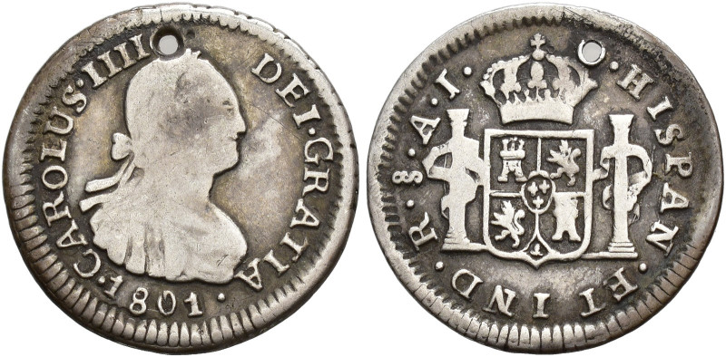 CARLOS IV. 1/2 real. 1801. Santiago. AJ. AR 1,63 g. 17,2 mm. VI-294. Agujero. BC...